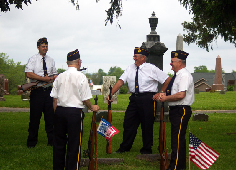 Members of Post 555 Honor Guard chat before the service. 