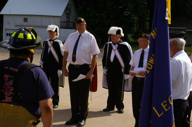 Legionnaires Ed Mertins and Bob Jacobs along with members of the Knights of Columbus stand at attention during the ceremony.